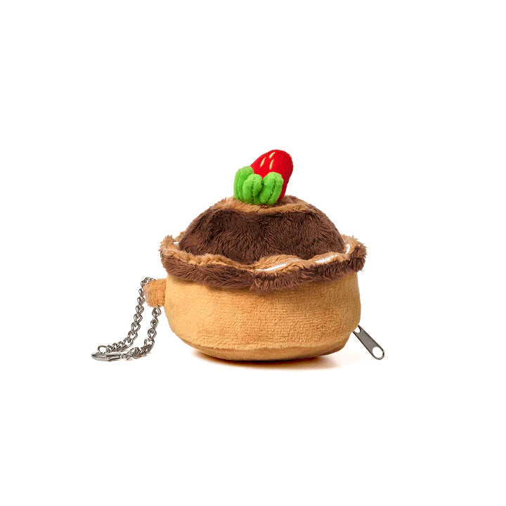 
                      
                        picture showing the pouch keychain made by heesung in the shape of a round strawberry cake
                      
                    